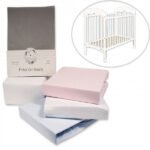 Fitted cot sheets in pink and white with packaging and a small inset of a crib.